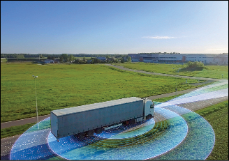 Futuristic High-Tech Concept: Big Semi Truck with Cargo Trailer Drives on the Road is Transformed with Graphics Special Effects Into Digitalized Advanced Autonomous Truck Concept. Aerial Drone Shot