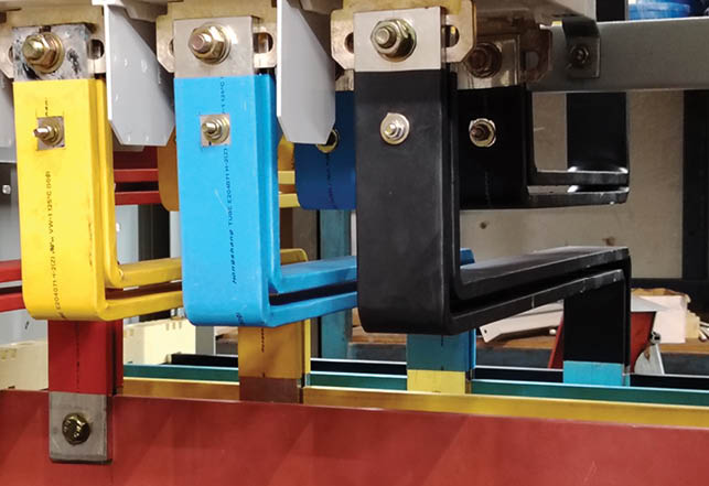 Sabah, Malaysia, June 28 2024 : Selective focus image of three phase copper busbar connection in low voltage switchboard.