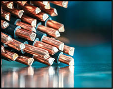 Metallic industrial space with a pile of copper cables