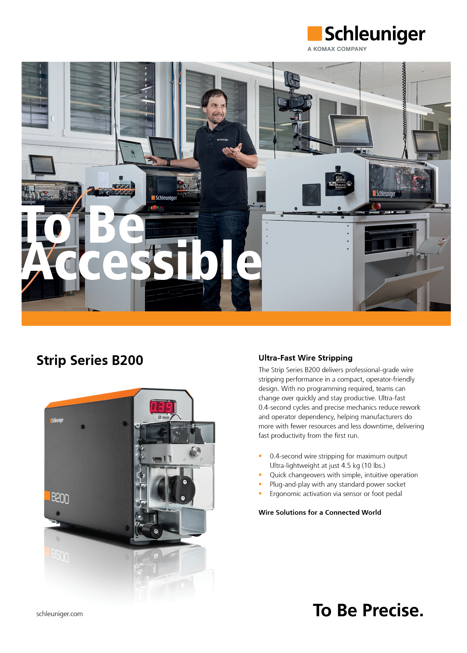 A man standing in front of a machine. Description generated by AI