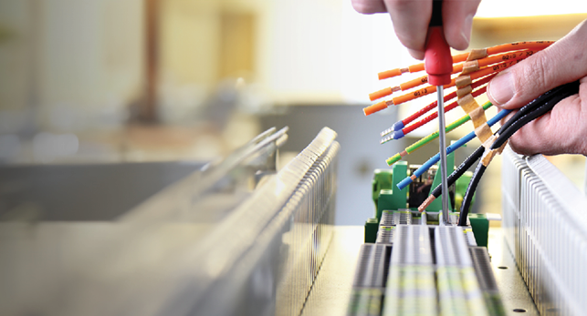 A person is cutting wires with a pair of scissors. AI generated content