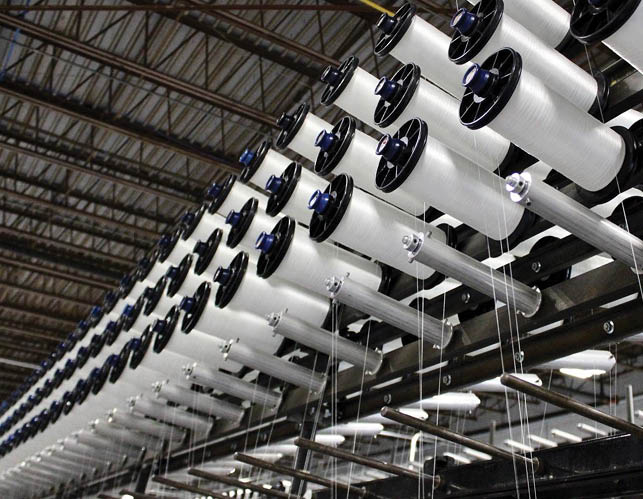 A factory with a conveyor belt of white cloth. AI generated content