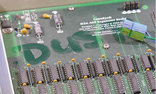 A computer circuit board with a green label that says “DUST" on it. AI generated content