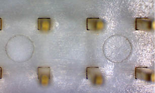 A close up of a silver object with several small circles on it. AI generated content