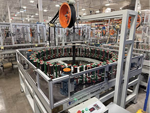 A conveyor belt with a machine on it. Description generated by AI