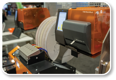 An orange machine with a screen and a keyboard. Description generated by AI