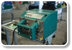 A green machine with a digital display. Description generated by AI